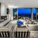 Living room of contemporary Newport Beach beach house showing lifeguard tower in background