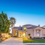 Front view of single-story home at sunset with deep blue sky