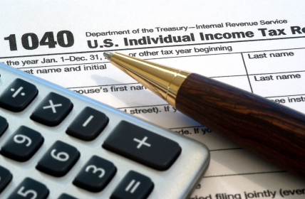 tax form with pen in front