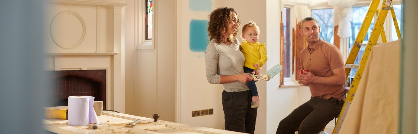 couple with child doing some home remodeling