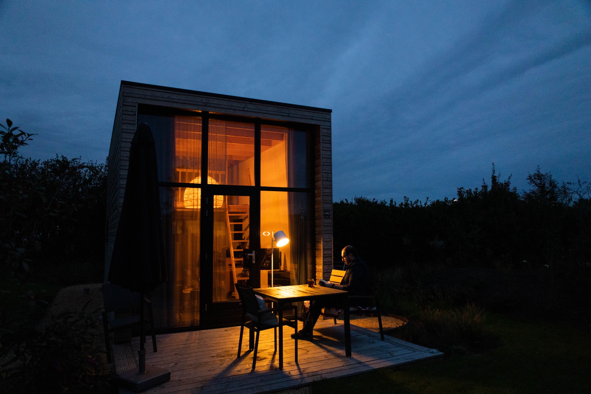 tiny house at sunset with table and chairs outside