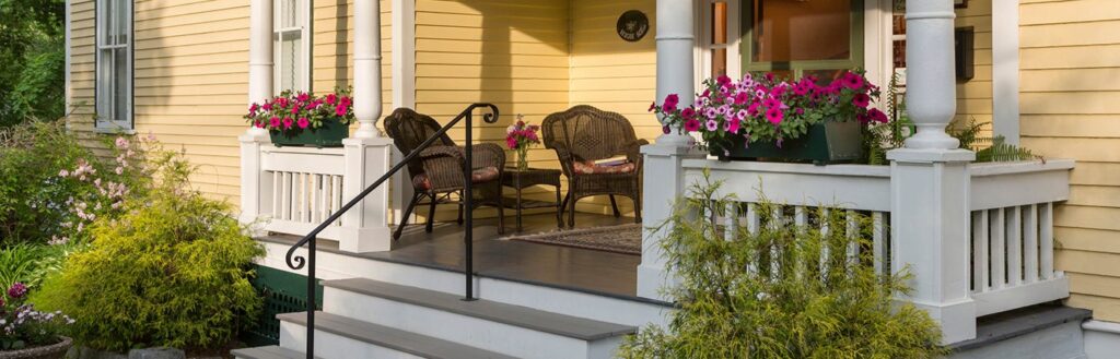 home exterior with porch and flowers