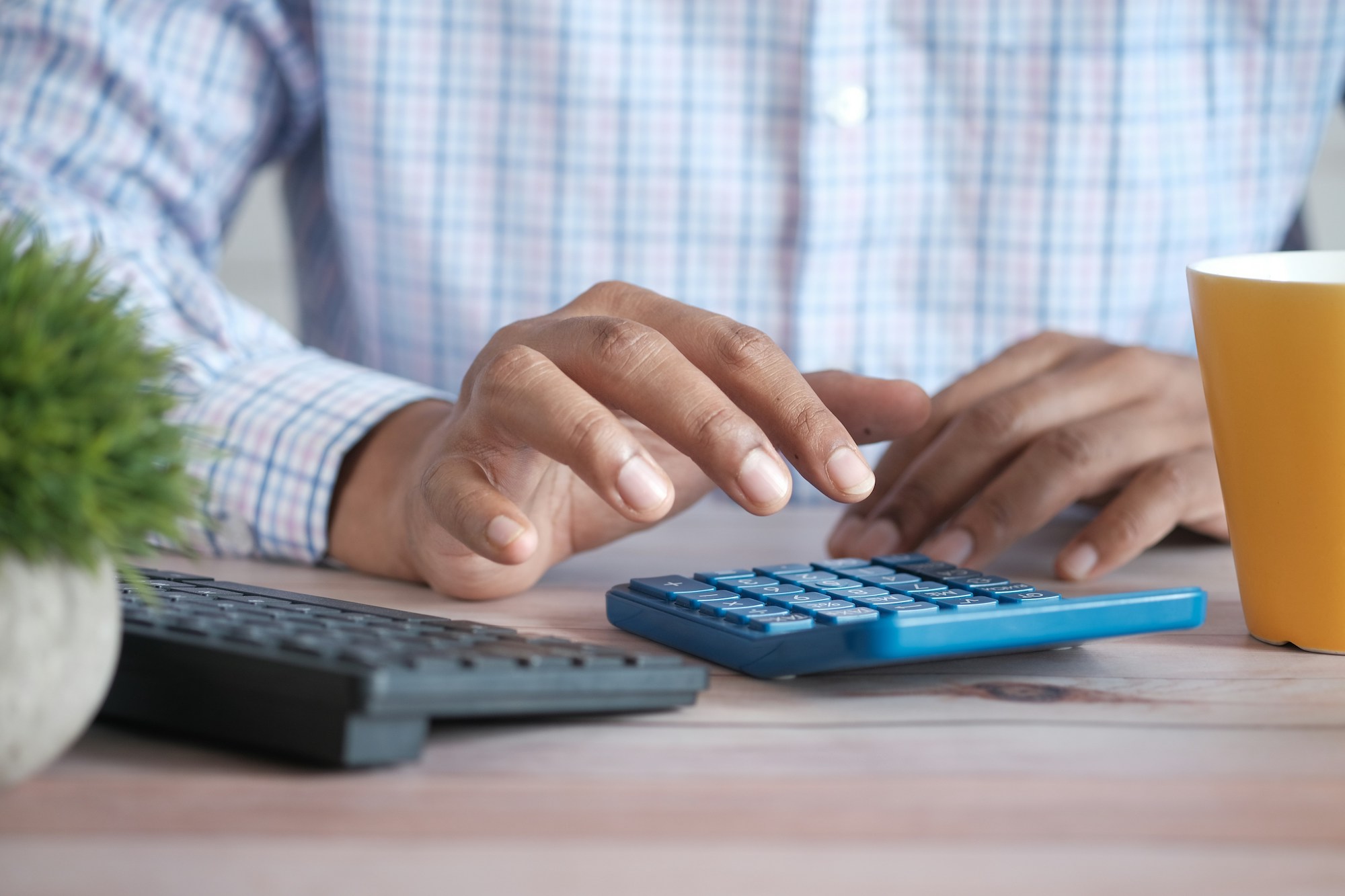 Man using calculator