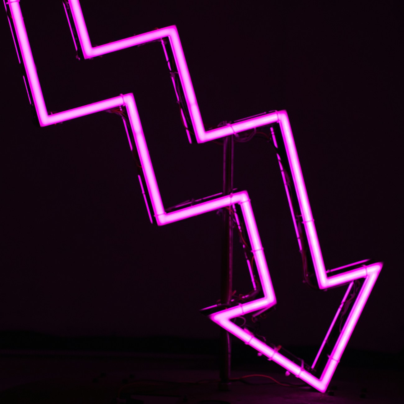 down arrow in neon lights