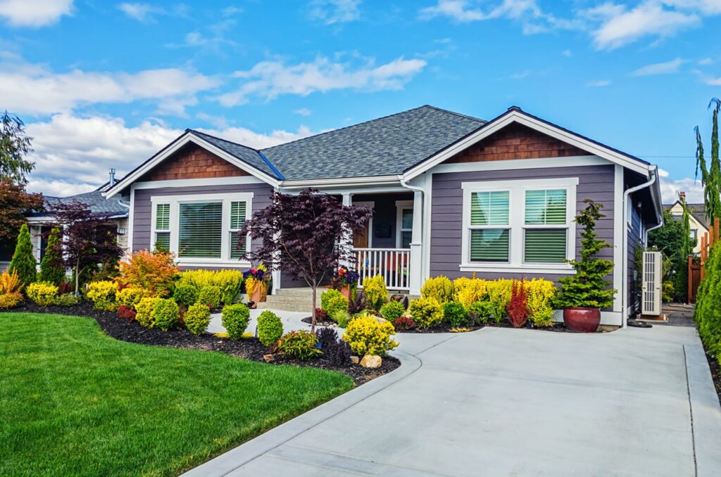 Home in spring, exterior of home with blooming flowers