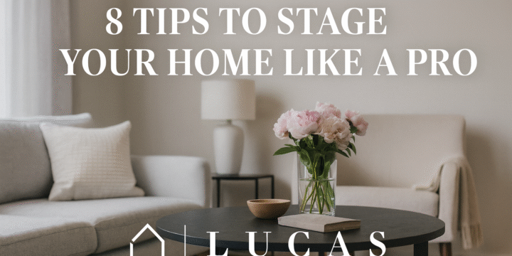Elegant living room with soft neutral tones, a modern sofa, and a vase of pink flowers on a coffee table. The text reads “8 Tips to Stage Your Home Like a Pro” with the Lucas Real Estate logo centered below, maintaining a clean and luxurious aesthetic.