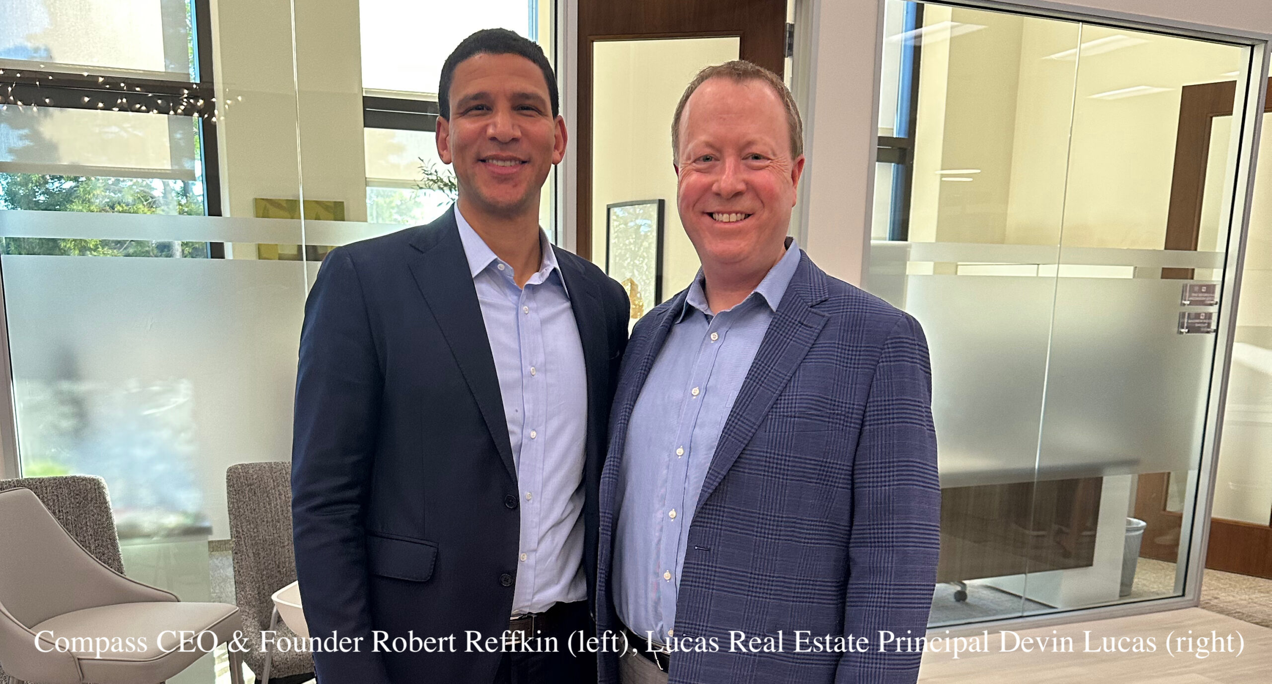 Photo of Devin Lucas of Lucas Real Estate Group with Compass CEO and Founder Robert Reffkin at the Coldwell Banker Newport Beach office in Newport Beach, California